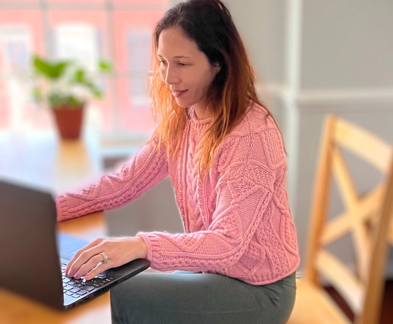 Dr. Nicole Rowe working at computer