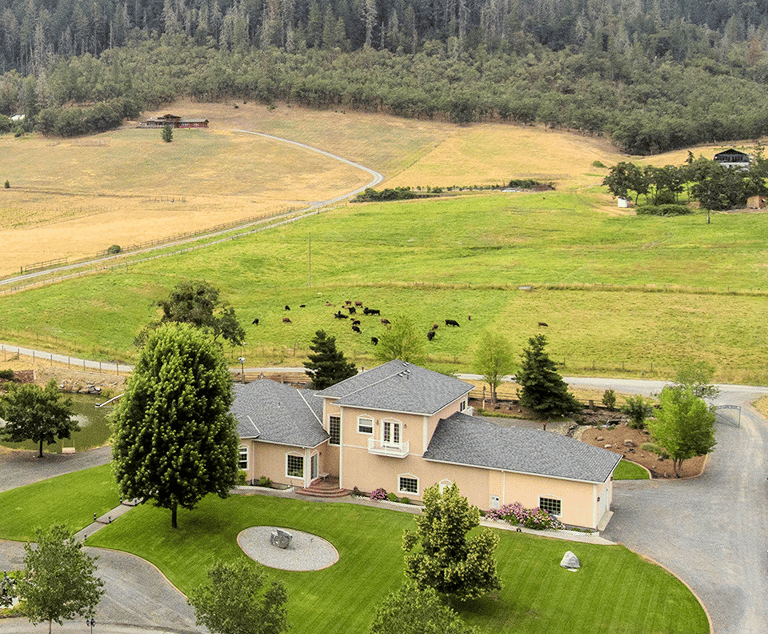 a large house with a large yard and a large field