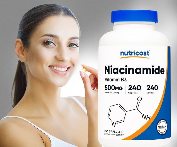 a woman holding a bottle of vitamin supplements