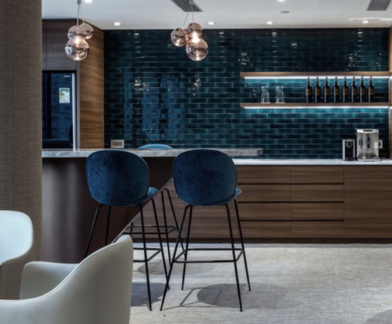 a modern looking bar with a bar stool and a bar stool