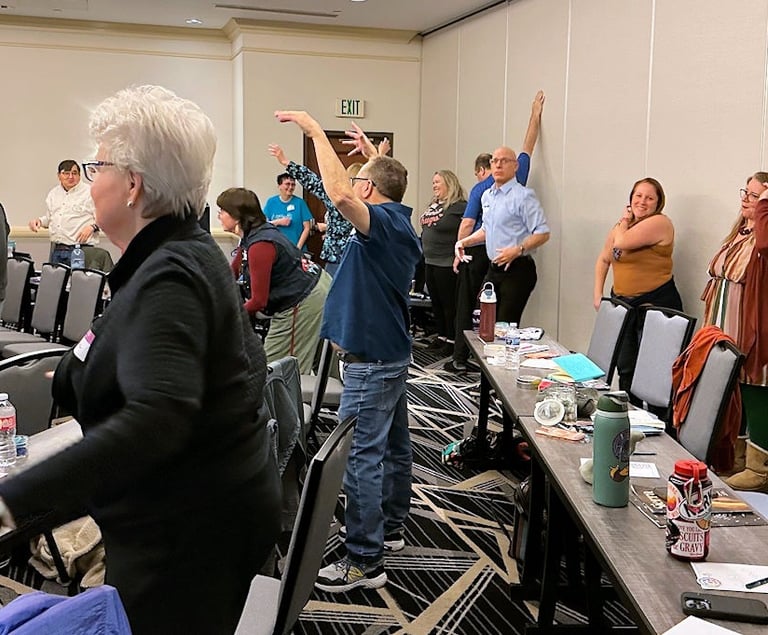 Conference attendees moving for an exercise at HCC 2026. Photo by Cheryl V