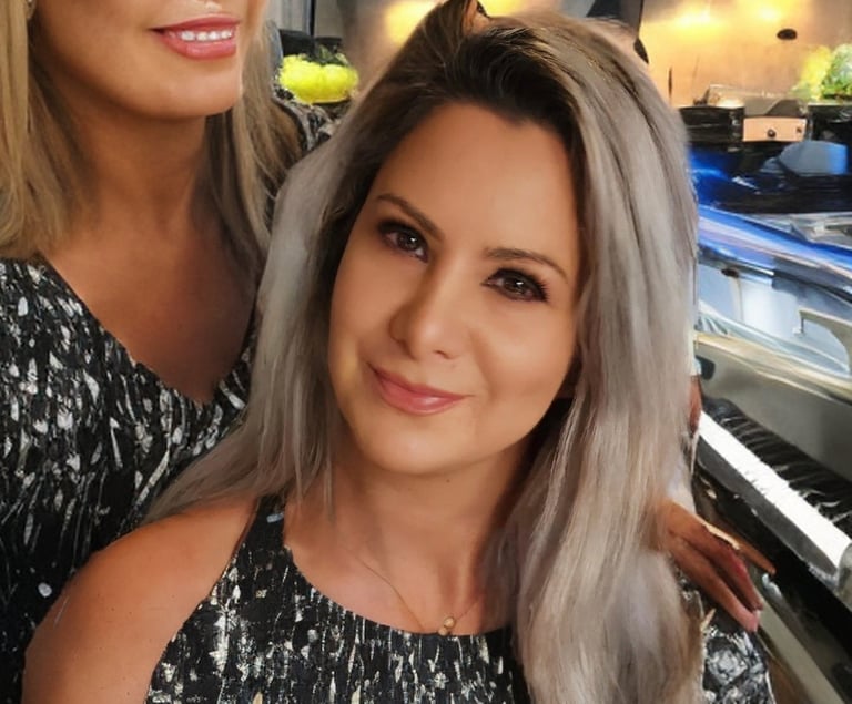 Ai-generated artwork that shows random weird people behind pretty blonde girl, ai-generated artwork 