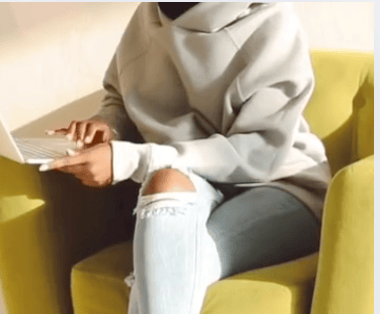 woman sitting on couch