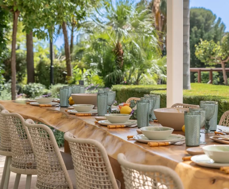 Al fresco dining terrace with wicker chairs at Villa Serenity