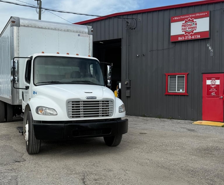 a truck in front of precision fleet services