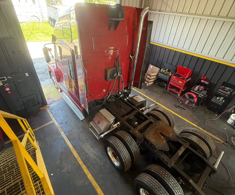a truck inside precision fleet services garage