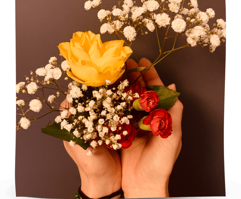 Martina holding flowers in her hands