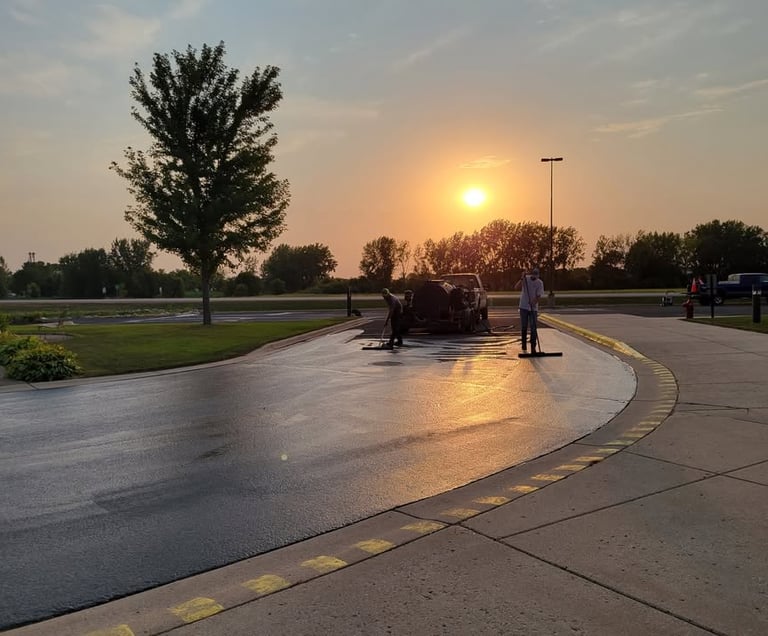 e-and-h-asphalt-crew-working-on-a-seal-coating-project.jpg