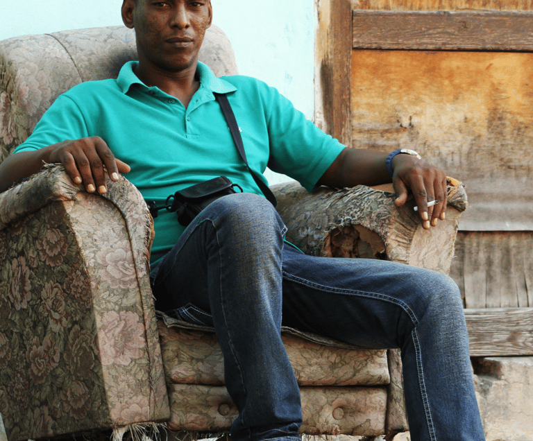 cuban man on couch in Havana