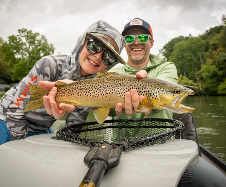 A photo of Kids fishing on the South Holston River in Tennessee.