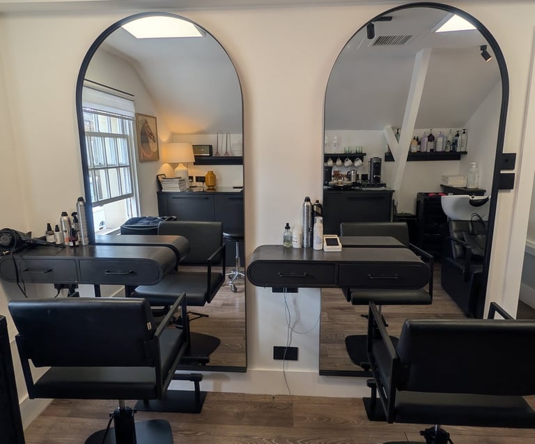 a salon and beauty salon with a large mirror