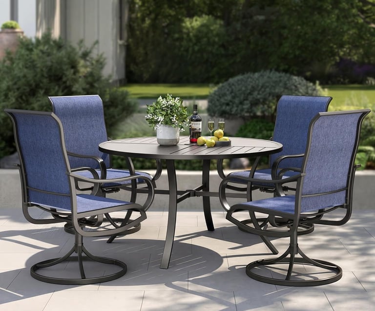 A 5-piece outdoor dining set with a round metal table and four blue swivel chairs on a garden patio.