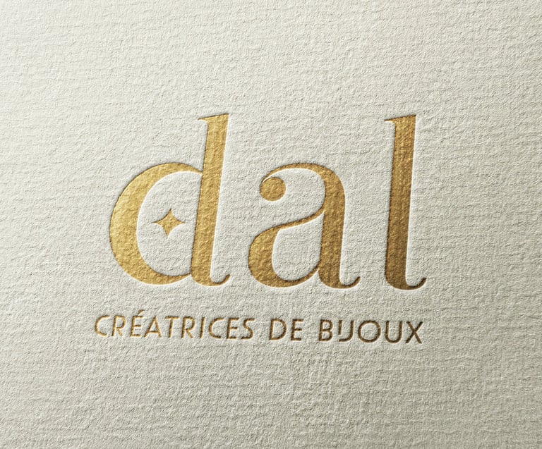 Identité visuelle DAL Créations, application logo doré sur papeterie