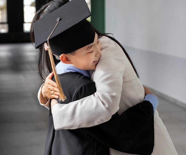 a woman in a graduation cap and gown is giving a hug