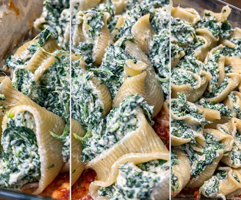 Baked jumbo pasta shells stuffed with creamy spinach and ricotta cheese over marinara sauce.