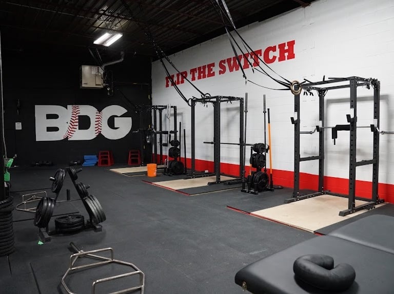 a gym room with a bench and a bench with a bench top