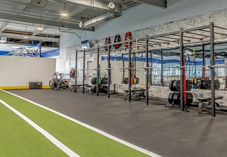 a gym with a racket and a racket with a racket