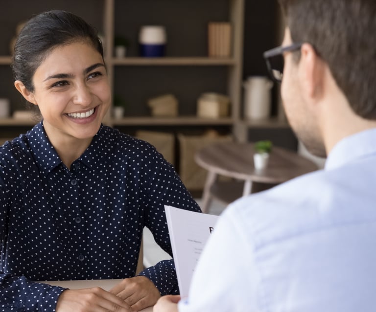 International nurse smiling at interview.