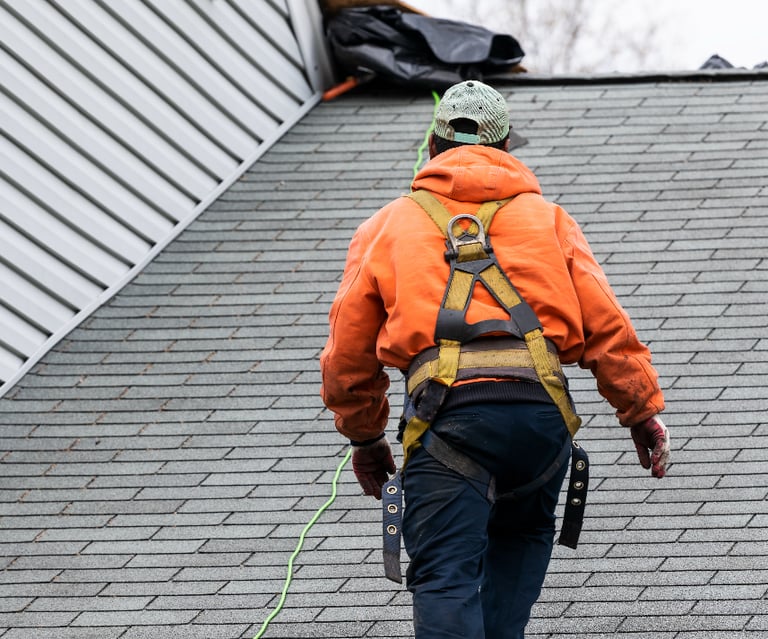 Worker roofing Cleveland Homes