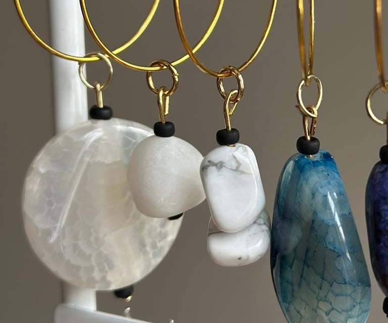 Rosevale Accessories handmade gemstone wine charms on jewelry display