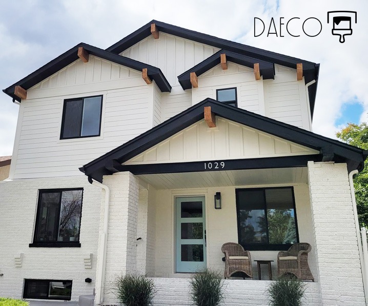 a white house with a black and white trimming