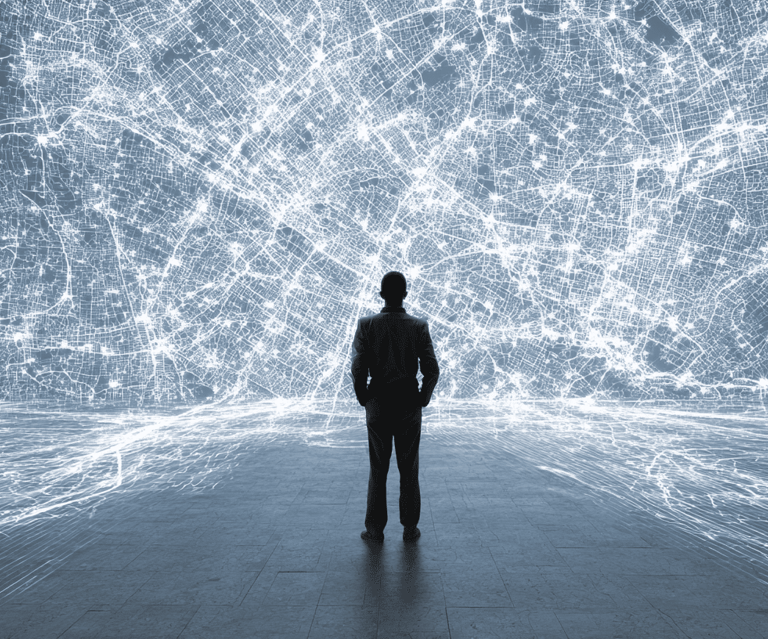 a man standing in front of a large, white and blue light