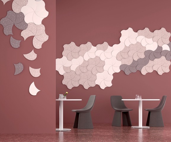 Modern decorative acoustic wall panels in a floral pattern for sound insulation in a cafe interior.
