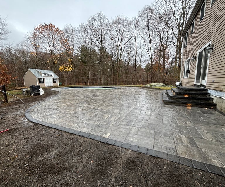 outdoor patio surrounding pool area