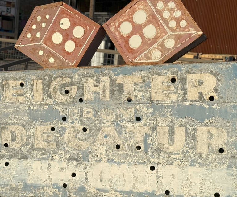 Vintage eighter from Decatur sign with red dice, blue background and white lettering
