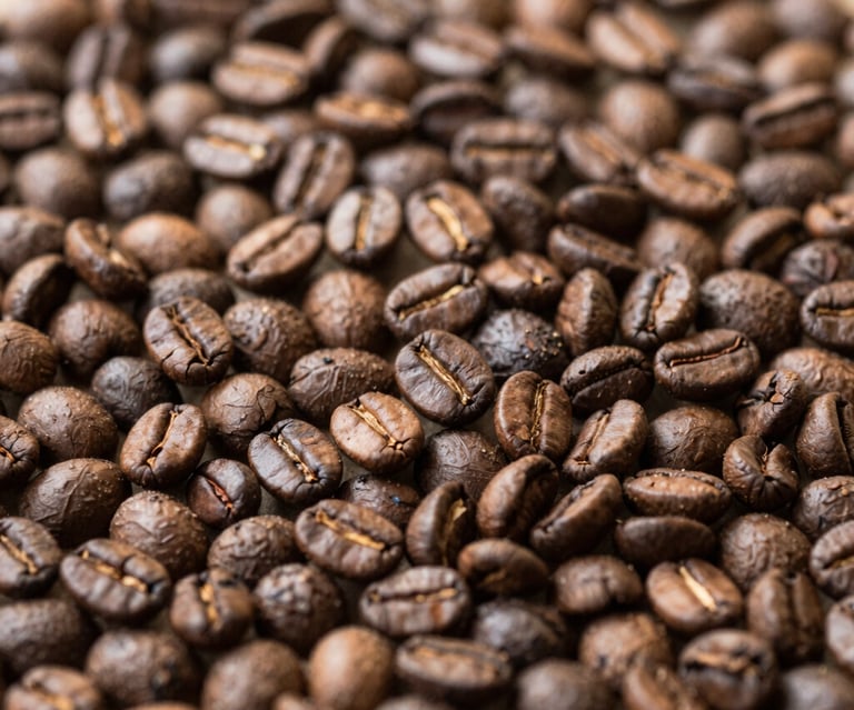 A variety of colorful drip coffee bags arranged on a rustic wooden table.