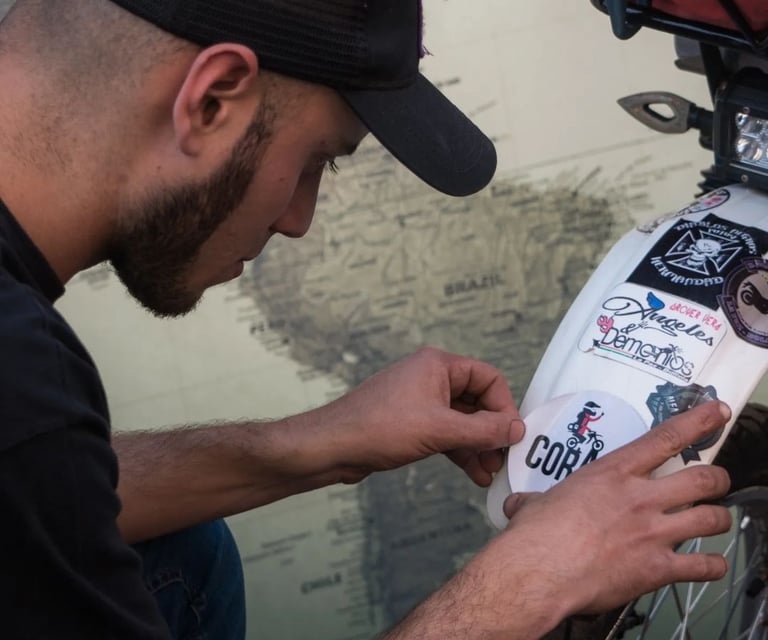 a man in a cap is working on a bike