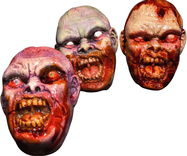 a group of three different colored zombie magnets 