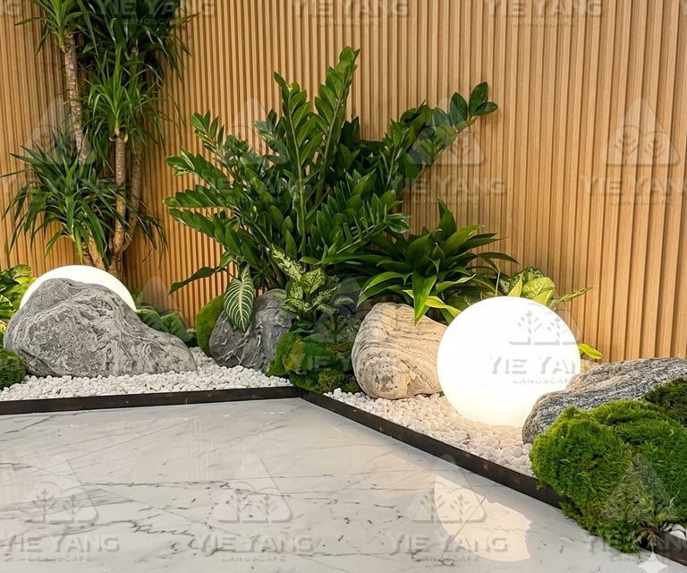 Indoor zen garden with glowing sphere light and decorative rocks – Yie Yang Landscape