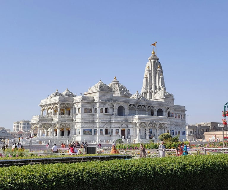 a large white building with a clock tower