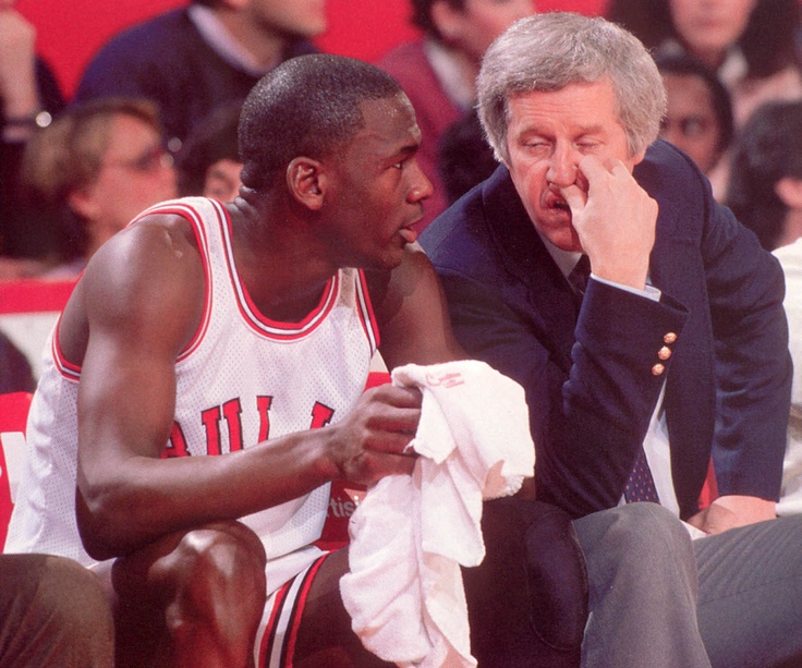 Michael Jordan and Chicago Bulls head coach Kevin Loughery in conversation on the bench (1984-85)