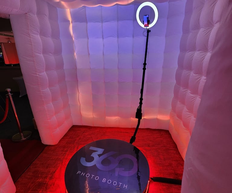 360 Photo Booth with light ring and led lighting around base.