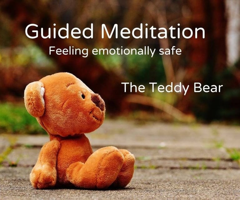 a teddy bear sitting on the ground
