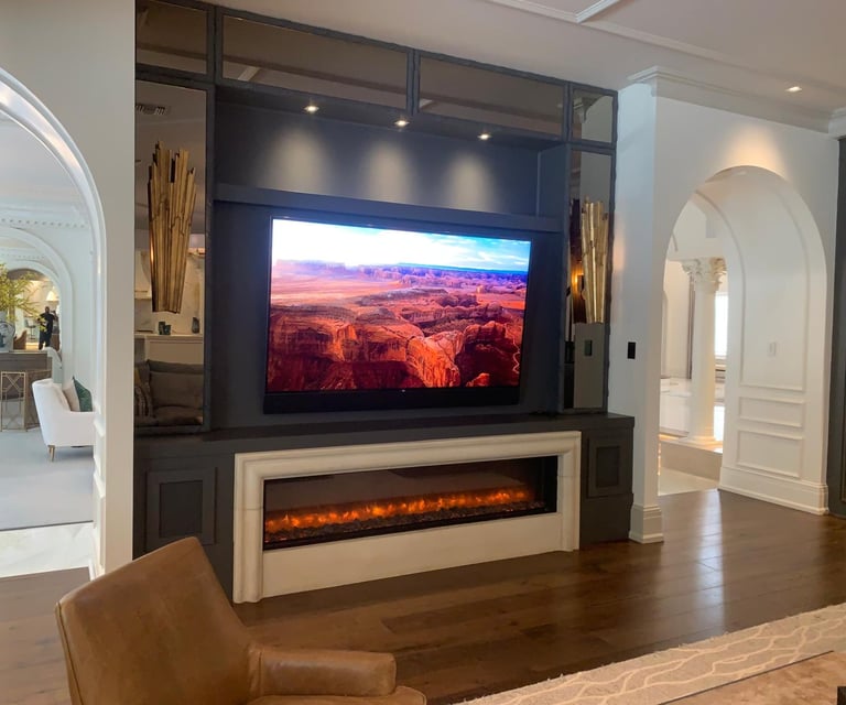 living room with a television and a fireplace