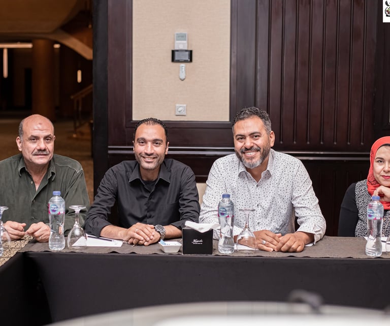 a group of people sitting at a table