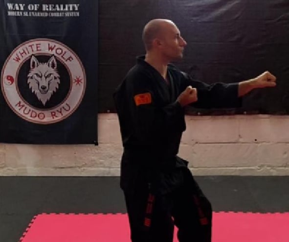 a man in black fighting stance