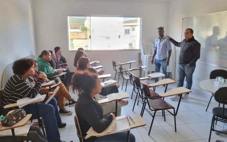 a man standing in front of a class room