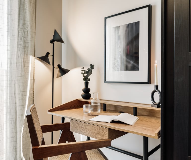 Working area with wood desk and subtle lighting, cozy decor and natural colour palette