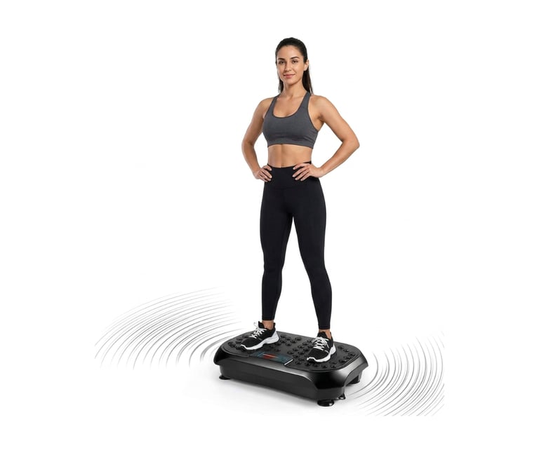 Woman standing on a vibration plate exercise machine in workout clothes.