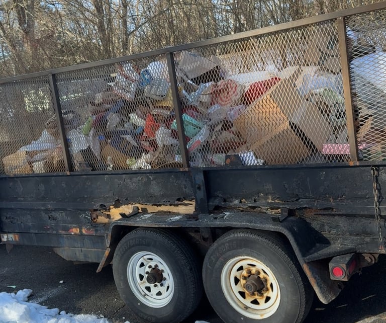 Old stove being removed from kitchen during renovation cleanout