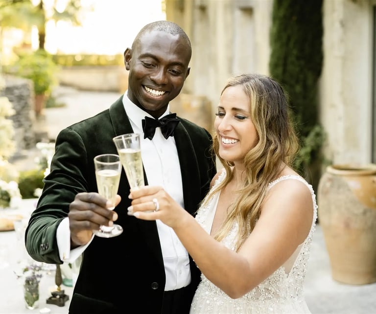 Elopement couple toasting with champagne at a luxury villa in Provence
