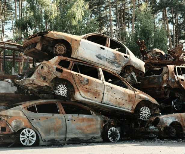 A pile of cars that are sitting on top of each other
