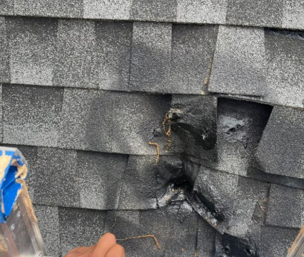 Emergency roof repair crew tarping wind damaged roof in Pantops Charlottesville VA