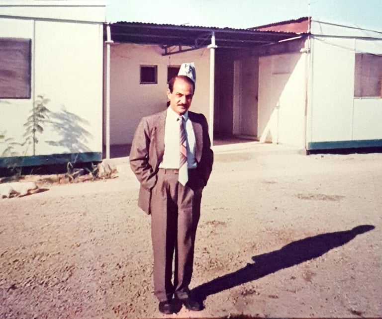 Ravinder Vashisht in front of building in Iraq