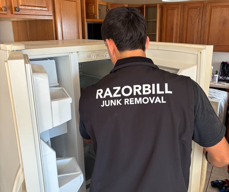 Razorbill Junk Removal removing an old refrigerator in San Antonio