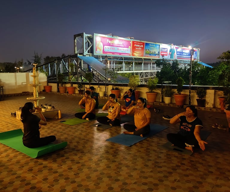 a group of people sitting on top of a roof